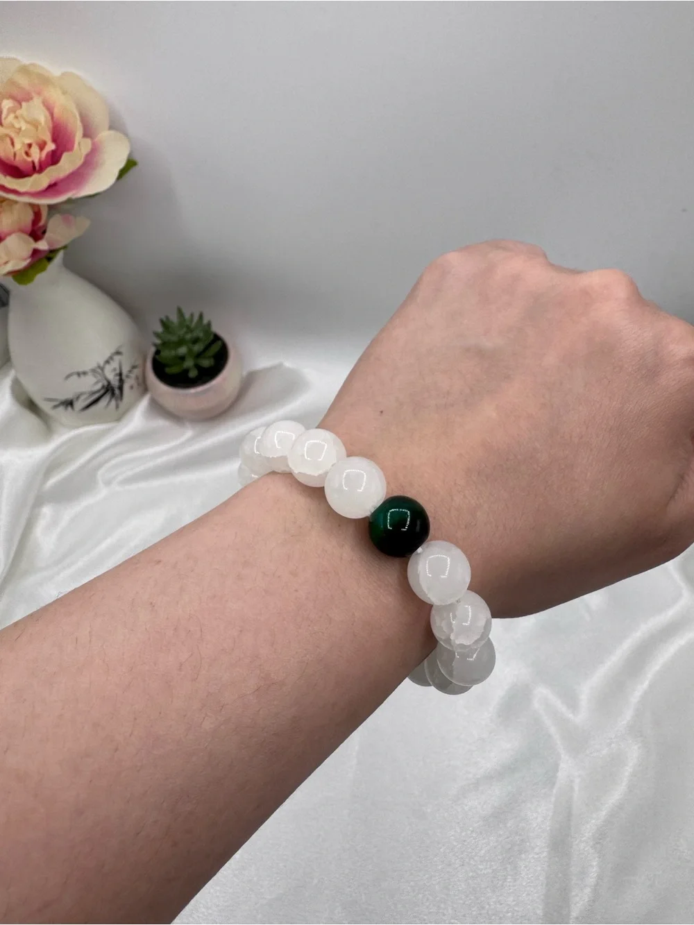 White Beaded Bracelet with Single Dark Accent Bead